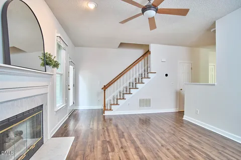 a view of entryway with wooden floor and a front door