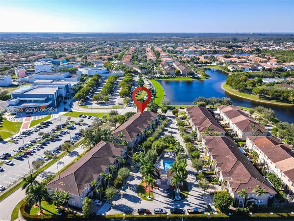 an aerial view of a houses and an outdoor space