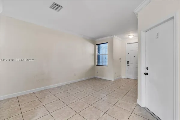 a view of an empty room and window