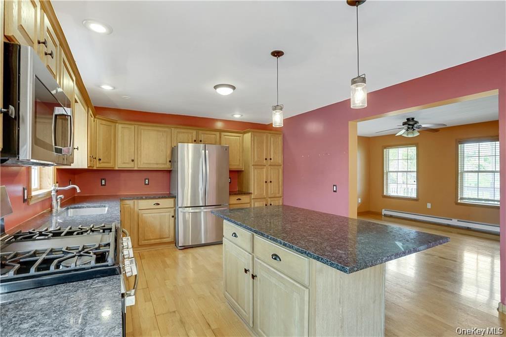 1 Tomkins Avenue Stony Point, NY 10980 - Photo 9 of 35 a kitchen with stainless steel appliances granite countertop a stove a refrigerator and a sink