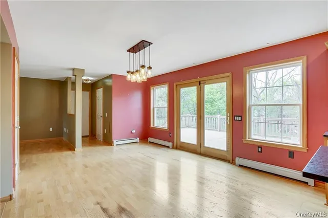 a kitchen with stainless steel appliances granite countertop a sink a stove and a wooden floors