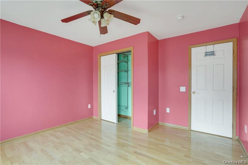 1 Tomkins Avenue Stony Point, NY 10980 - Photo 24 of 35 a view of empty room with wooden floor and fan