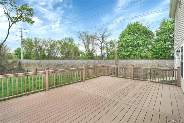 a view of a livingroom with a ceiling fan and window