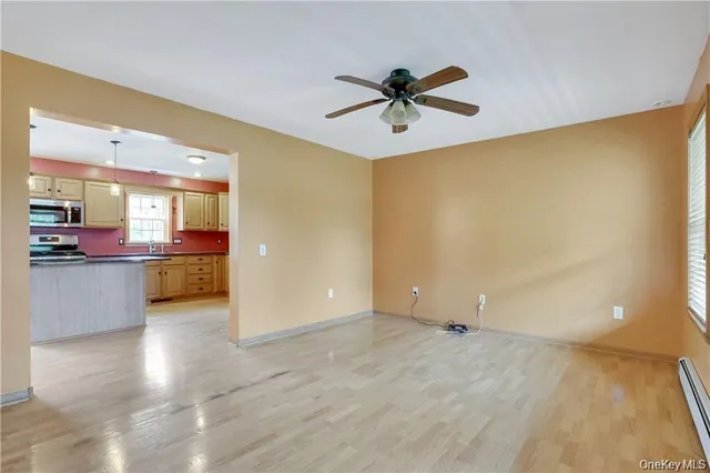 a view of a kitchen with a sink and a window