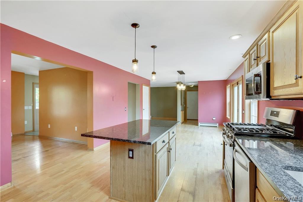 1 Tomkins Avenue Stony Point, NY 10980 - Photo 30 of 35 a kitchen with stainless steel appliances granite countertop a sink a stove and a wooden floors