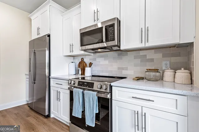a en suite bathroom with a sink a mirror and shower