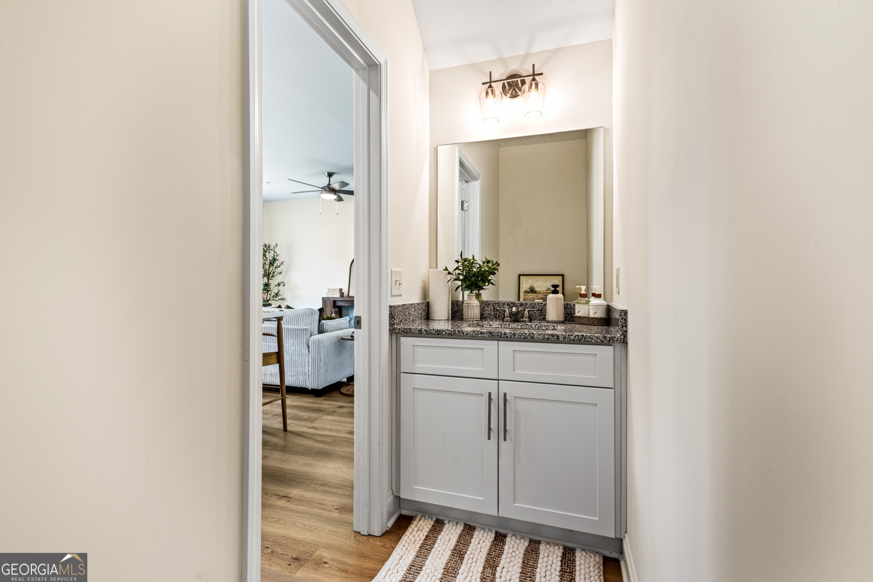 205 Starr Circle Stockbridge, GA 30281 - Photo 13 of 30 a en suite bathroom with a sink a mirror and shower