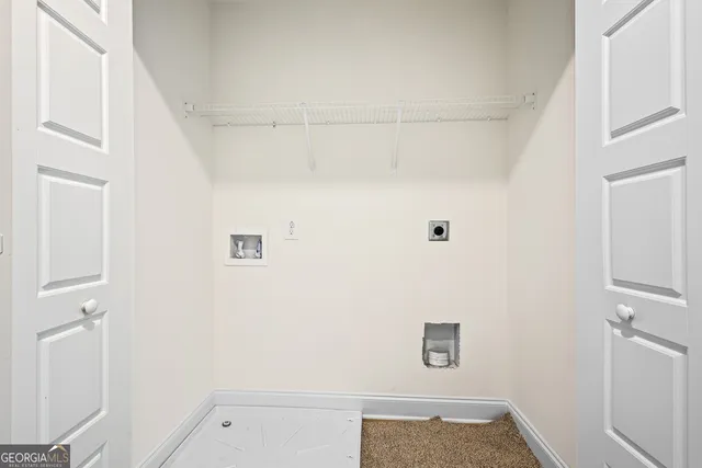 a spacious bedroom with a bed and a chandelier