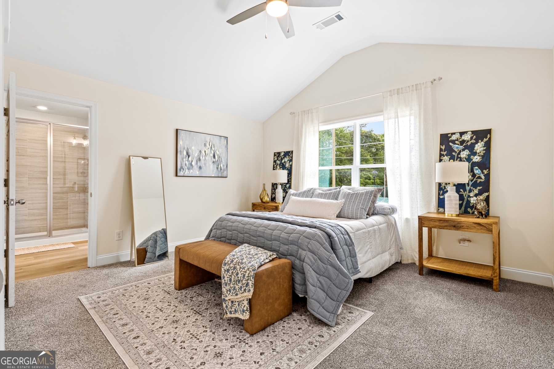 205 Starr Circle Stockbridge, GA 30281 - Photo 22 of 30 a spacious bedroom with a bed and a chandelier