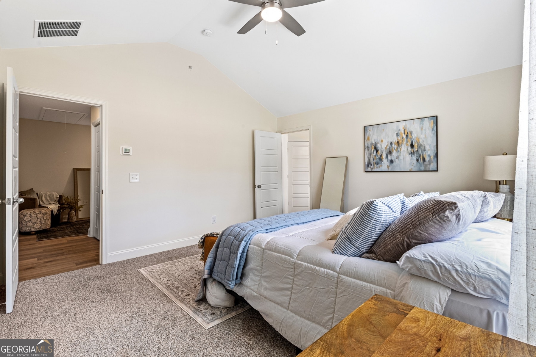 205 Starr Circle Stockbridge, GA 30281 - Photo 23 of 30 a bedroom with a large bed and a chandelier