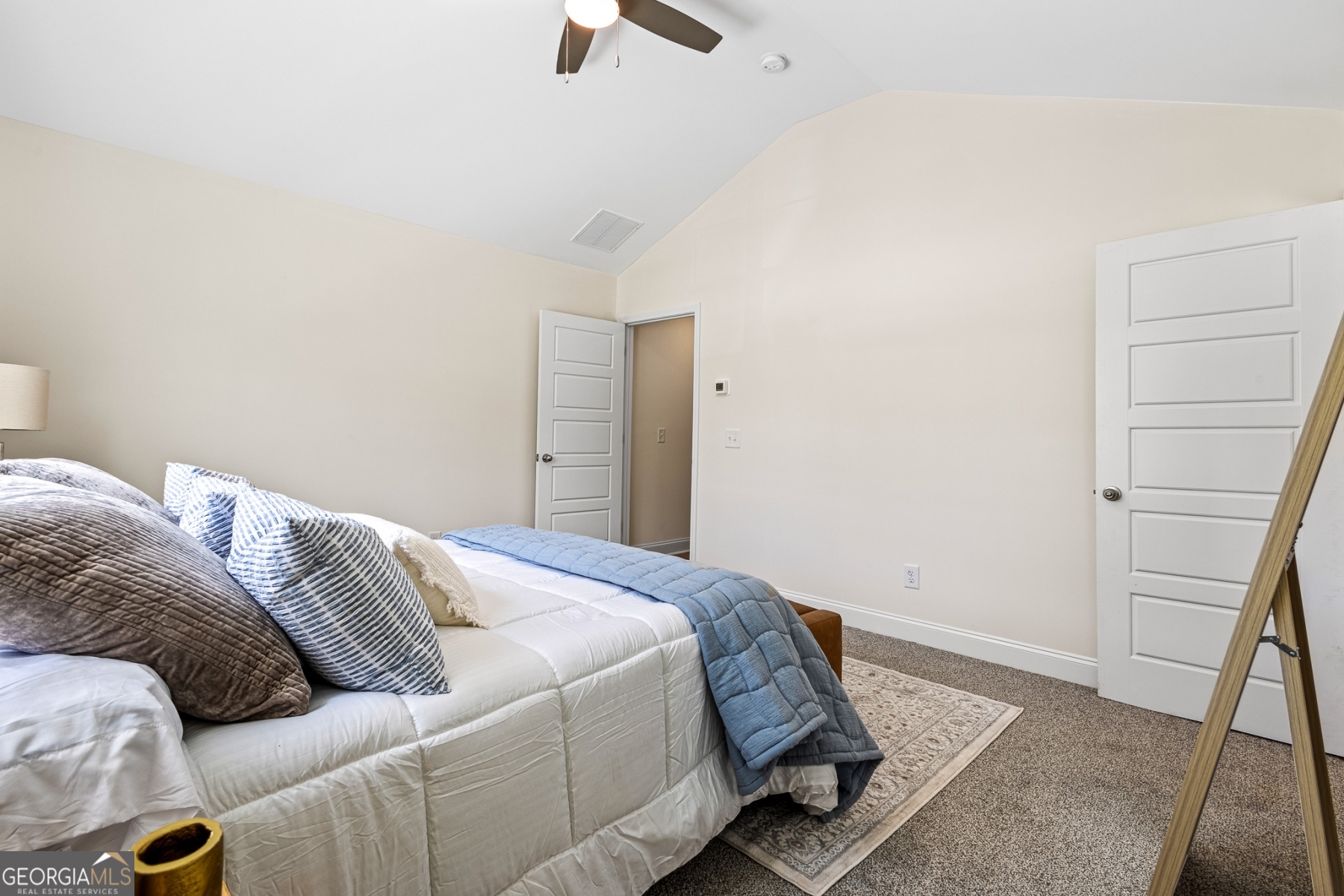 205 Starr Circle Stockbridge, GA 30281 - Photo 24 of 30 a bedroom with a bed and hardwood floor