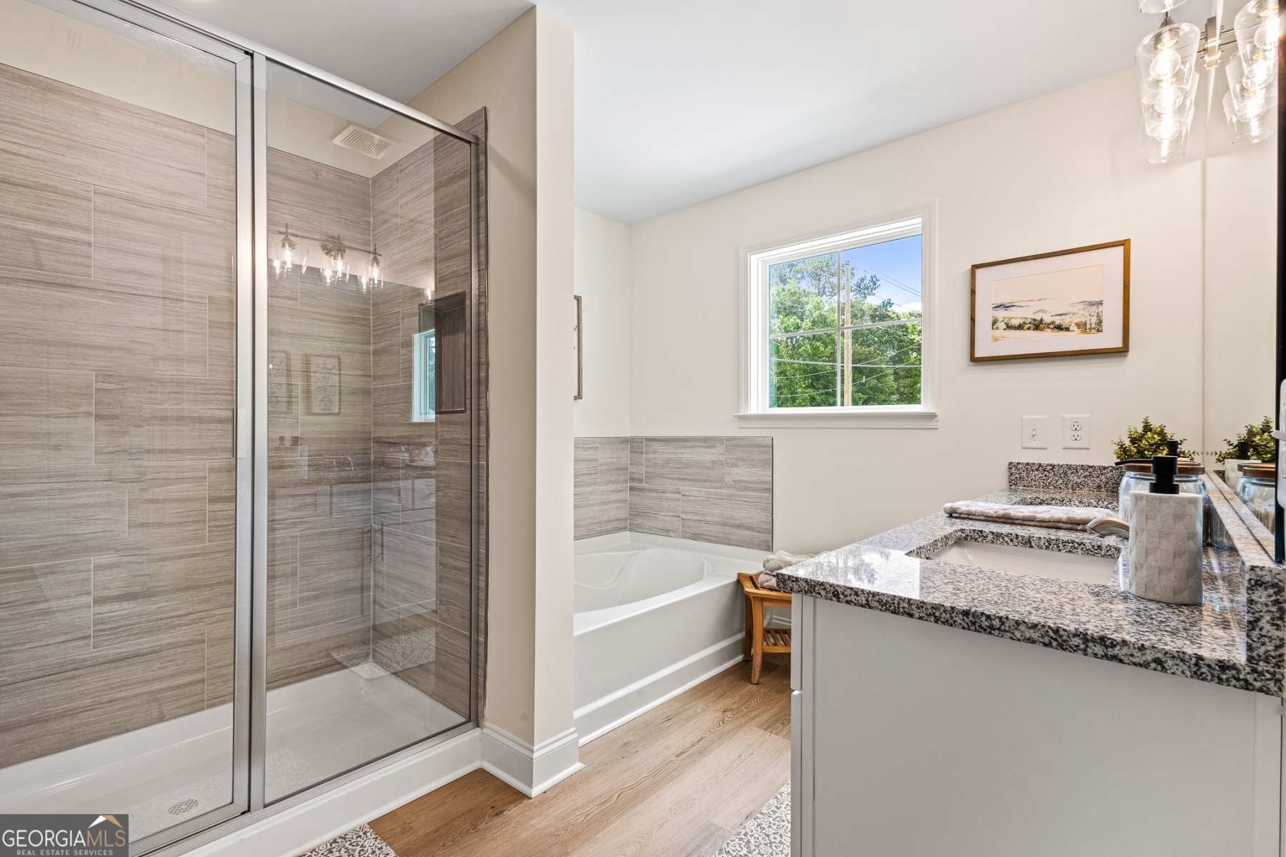 205 Starr Circle Stockbridge, GA 30281 - Photo 25 of 30 a bathroom with a granite countertop sink and a bathtub