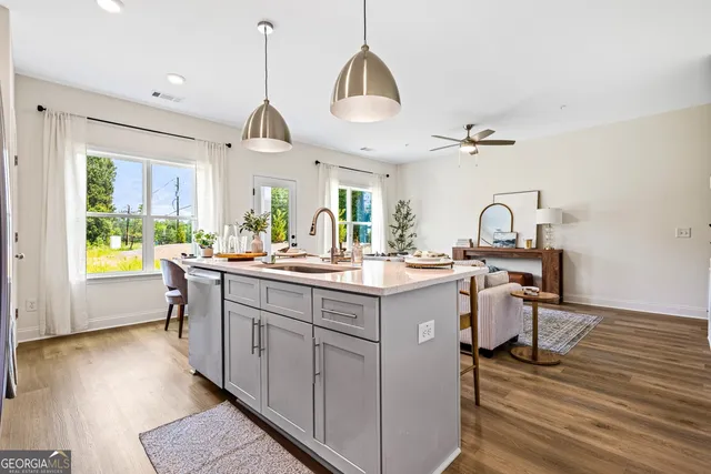 a kitchen with a sink and a refrigerator