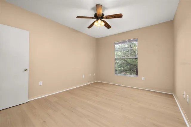 a white toilet sitting next to a bath tub
