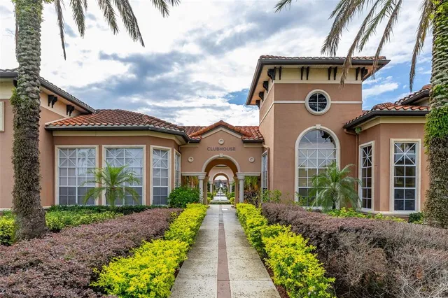 a view of a house with swimming pool and garden