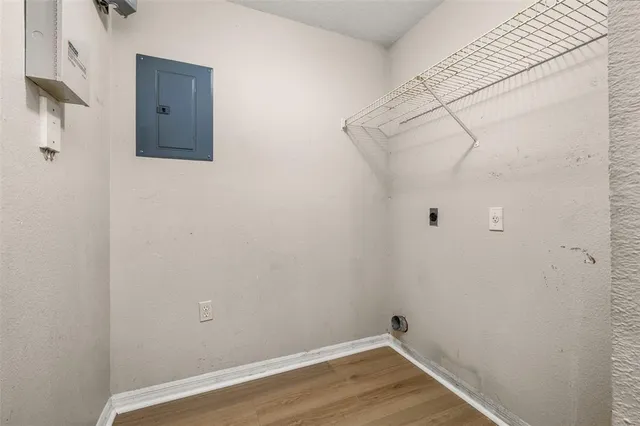 a kitchen with granite countertop stainless steel appliances white cabinets sink and stove