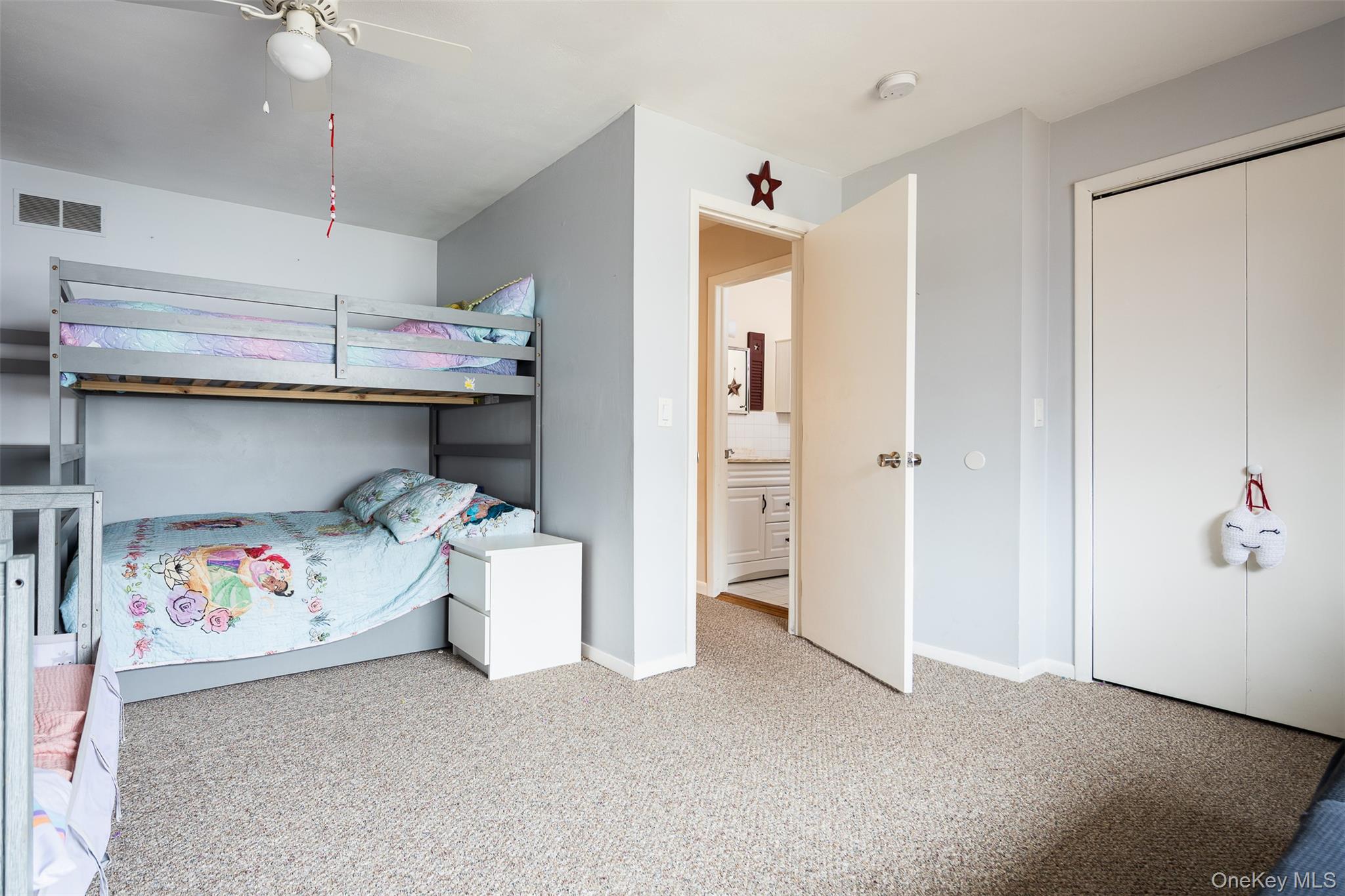 2 Fenwick Street Mastic, NY 11950 - Photo 11 of 27 a bedroom with a bed and cabinets