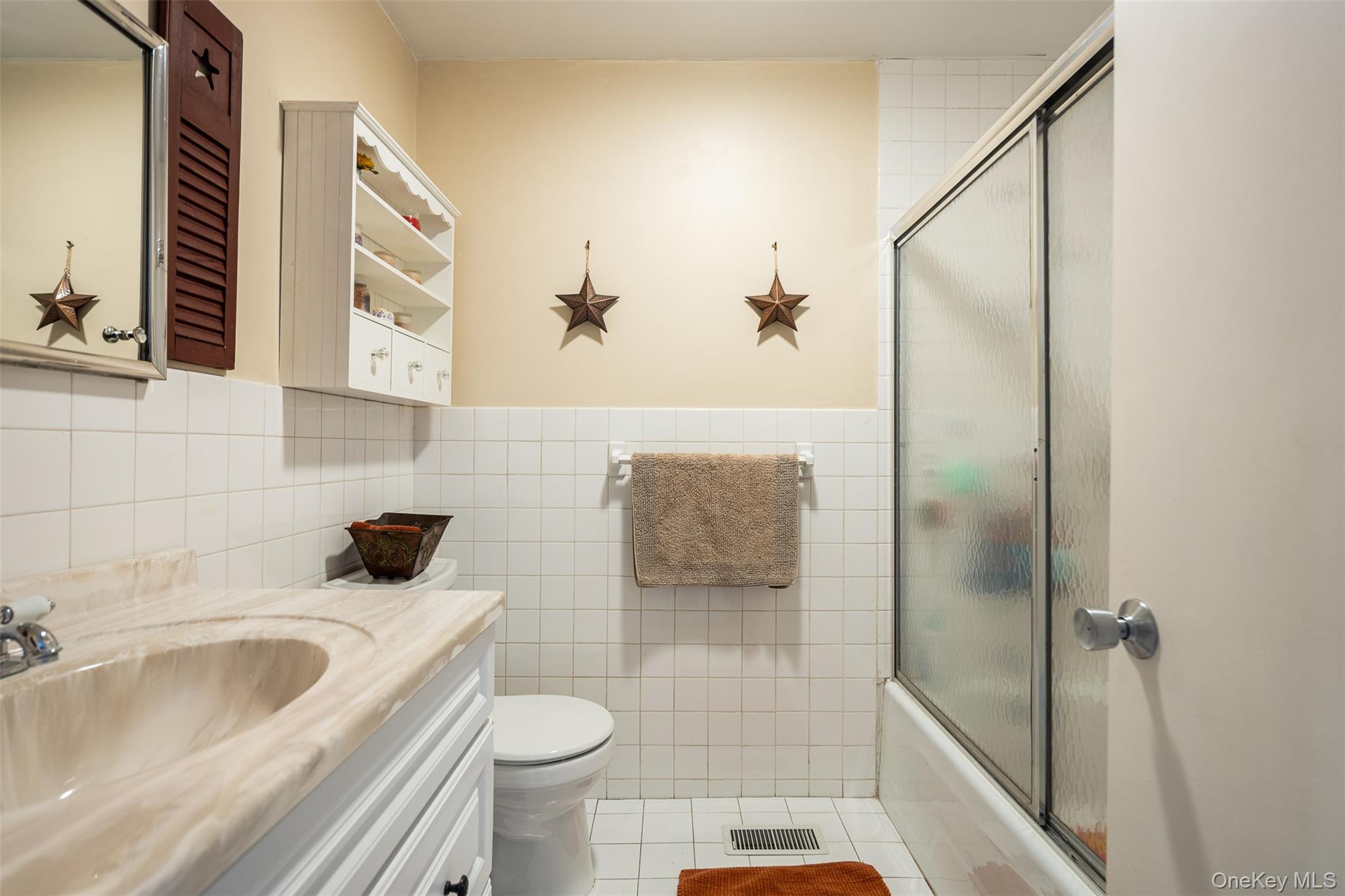 2 Fenwick Street Mastic, NY 11950 - Photo 12 of 27 a bathroom with a sink and toilet