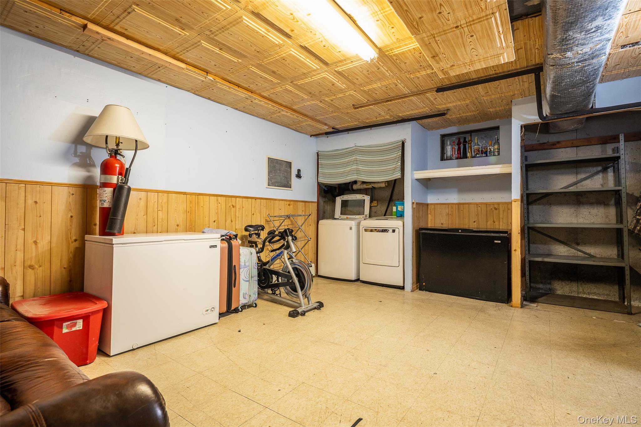 2 Fenwick Street Mastic, NY 11950 - Photo 13 of 27 a storage room with washer and dryer