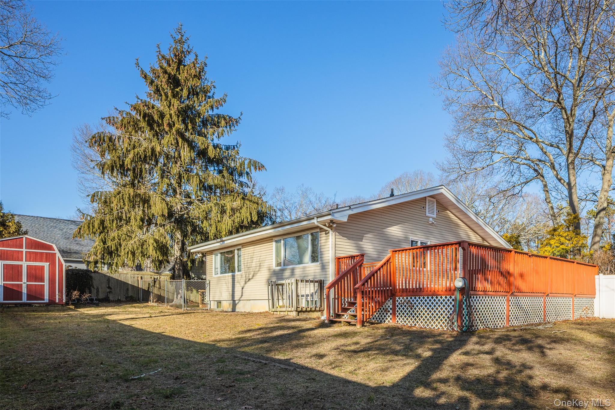 2 Fenwick Street Mastic, NY 11950 - Photo 20 of 27 a view of a house with a yard