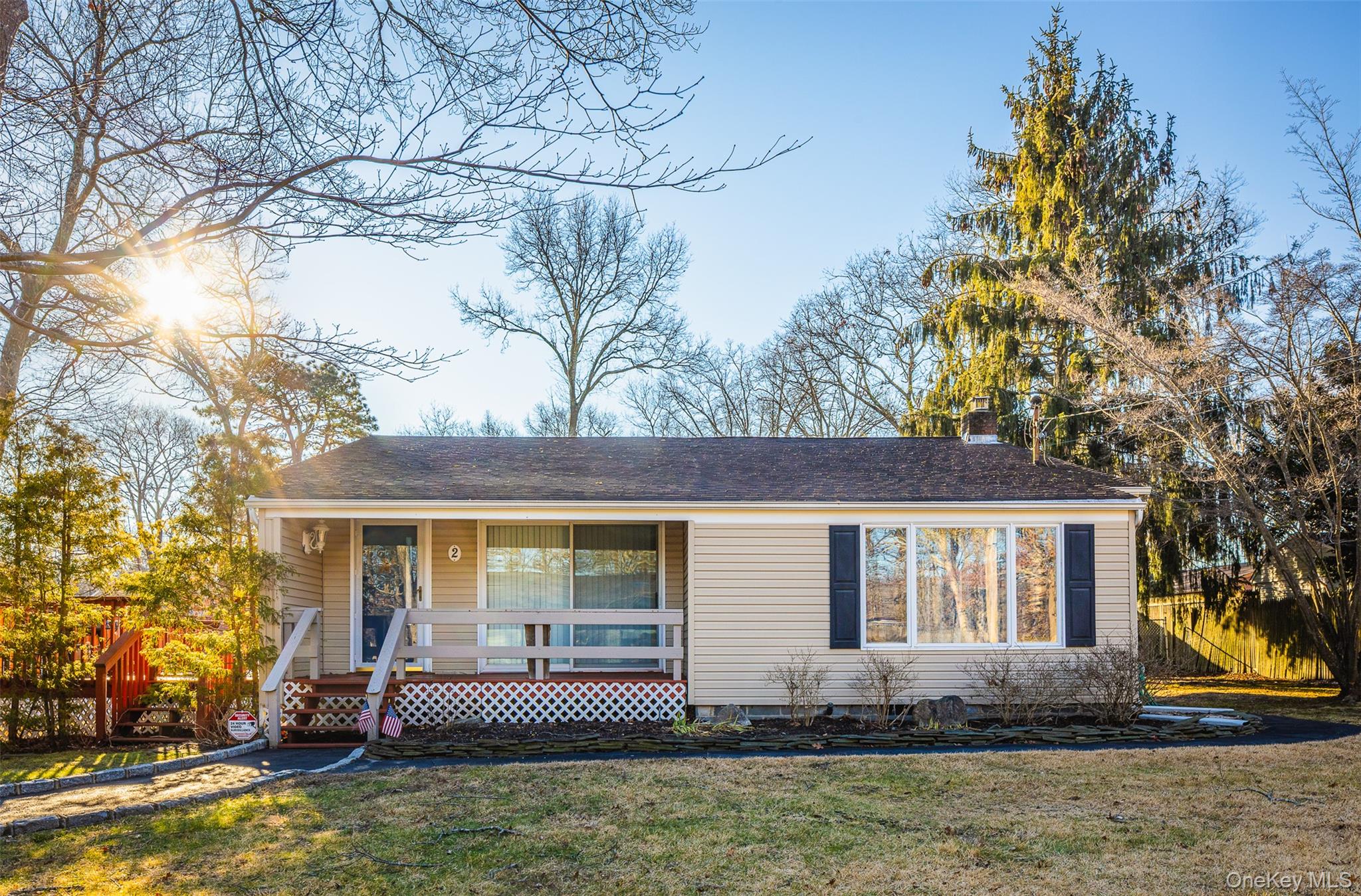 2 Fenwick Street Mastic, NY 11950 - Photo 2 of 27 a front view of a house with garden