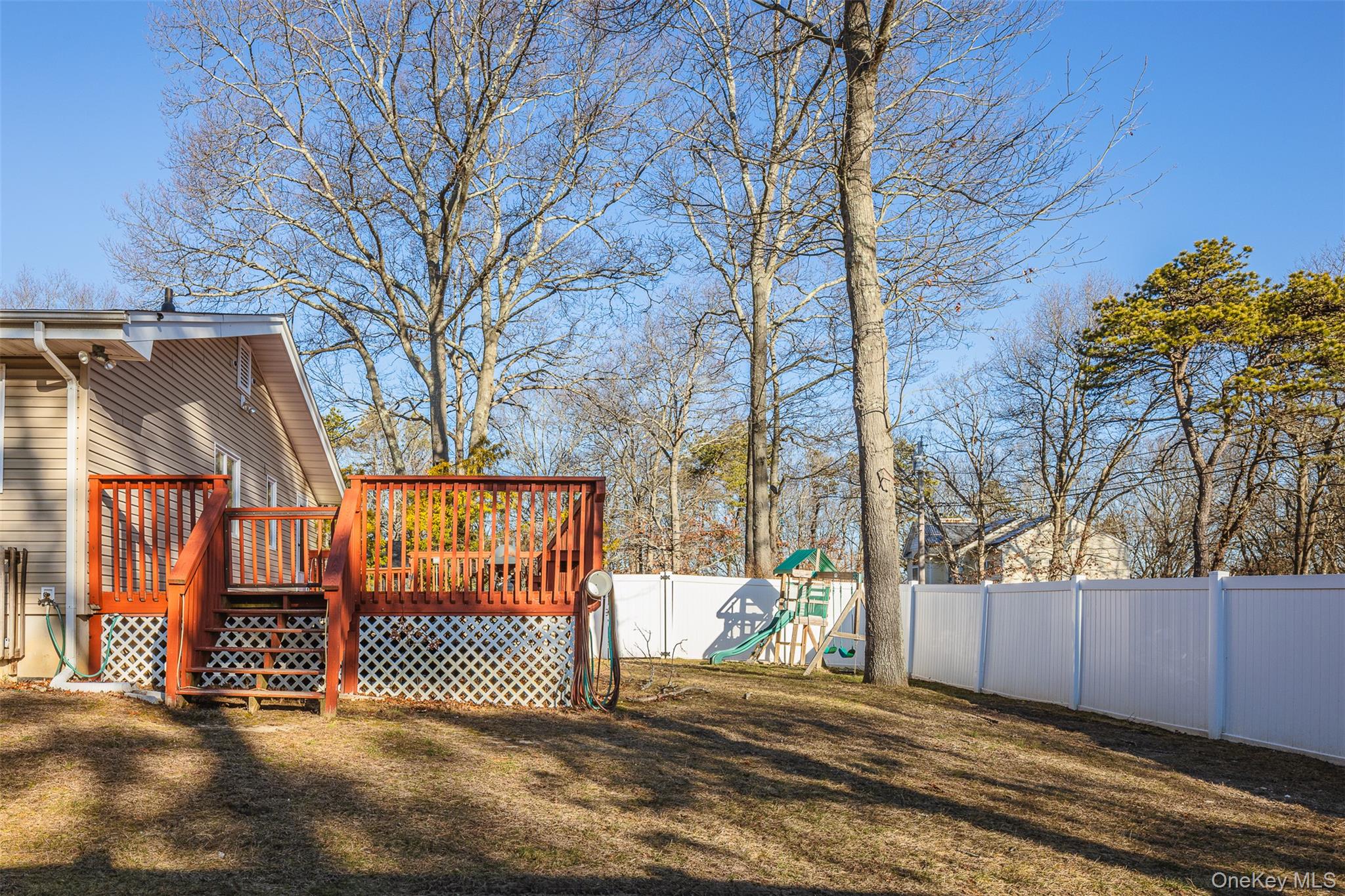 2 Fenwick Street Mastic, NY 11950 - Photo 21 of 27 a view of a backyard of the house