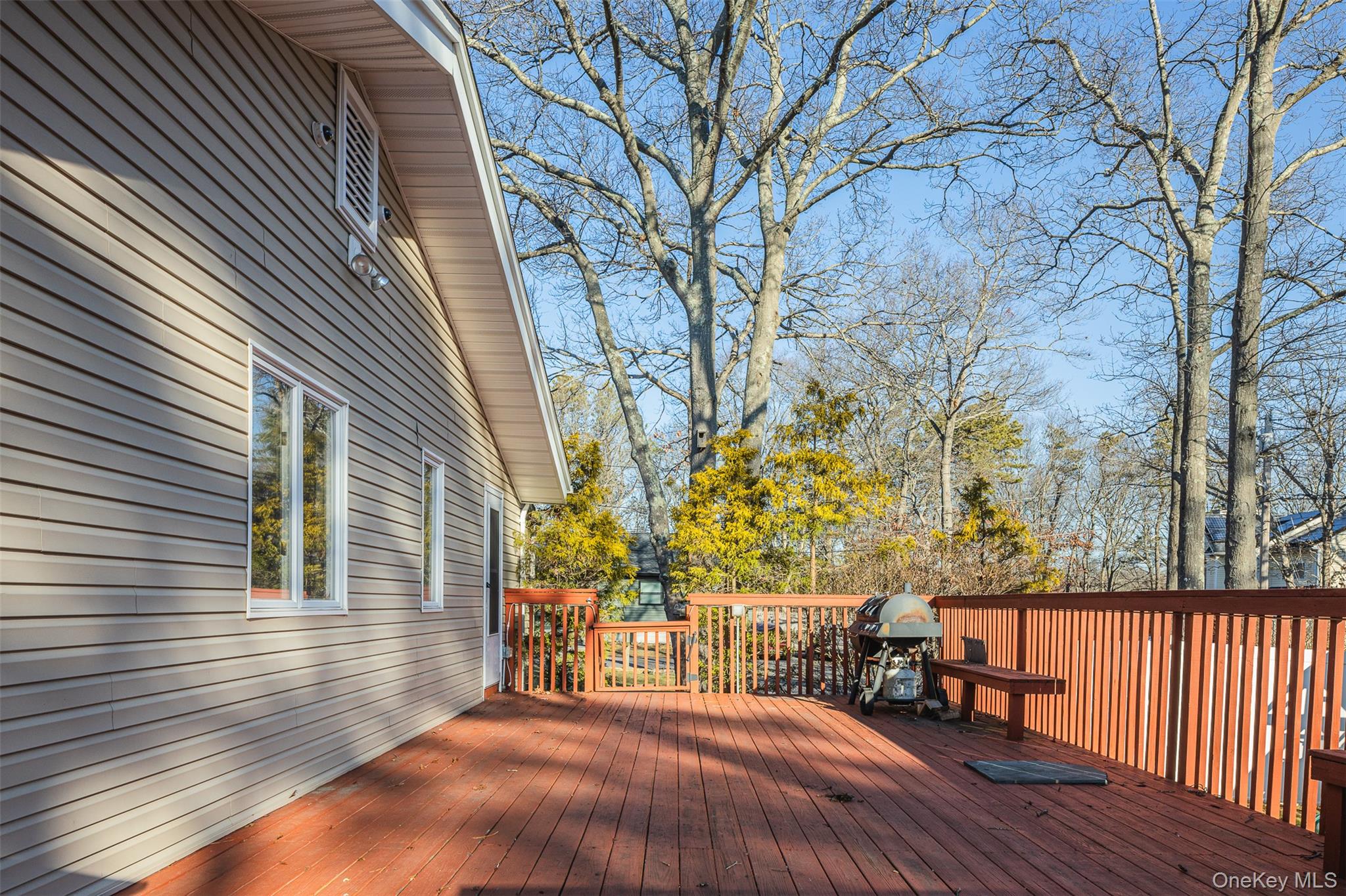 2 Fenwick Street Mastic, NY 11950 - Photo 22 of 27 a view of outdoor space with deck and tree