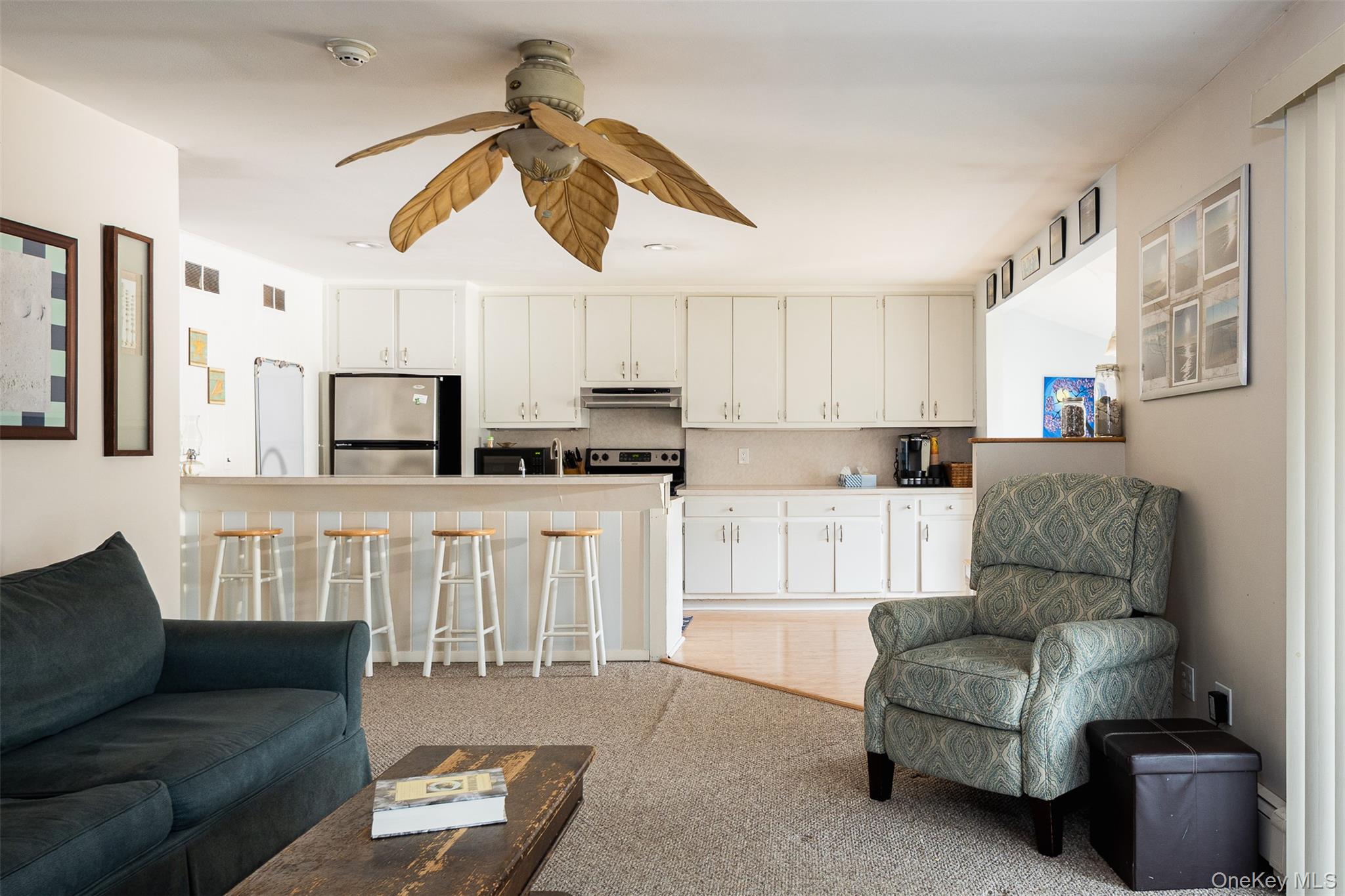 2 Fenwick Street Mastic, NY 11950 - Photo 3 of 27 a living room with furniture and kitchen view
