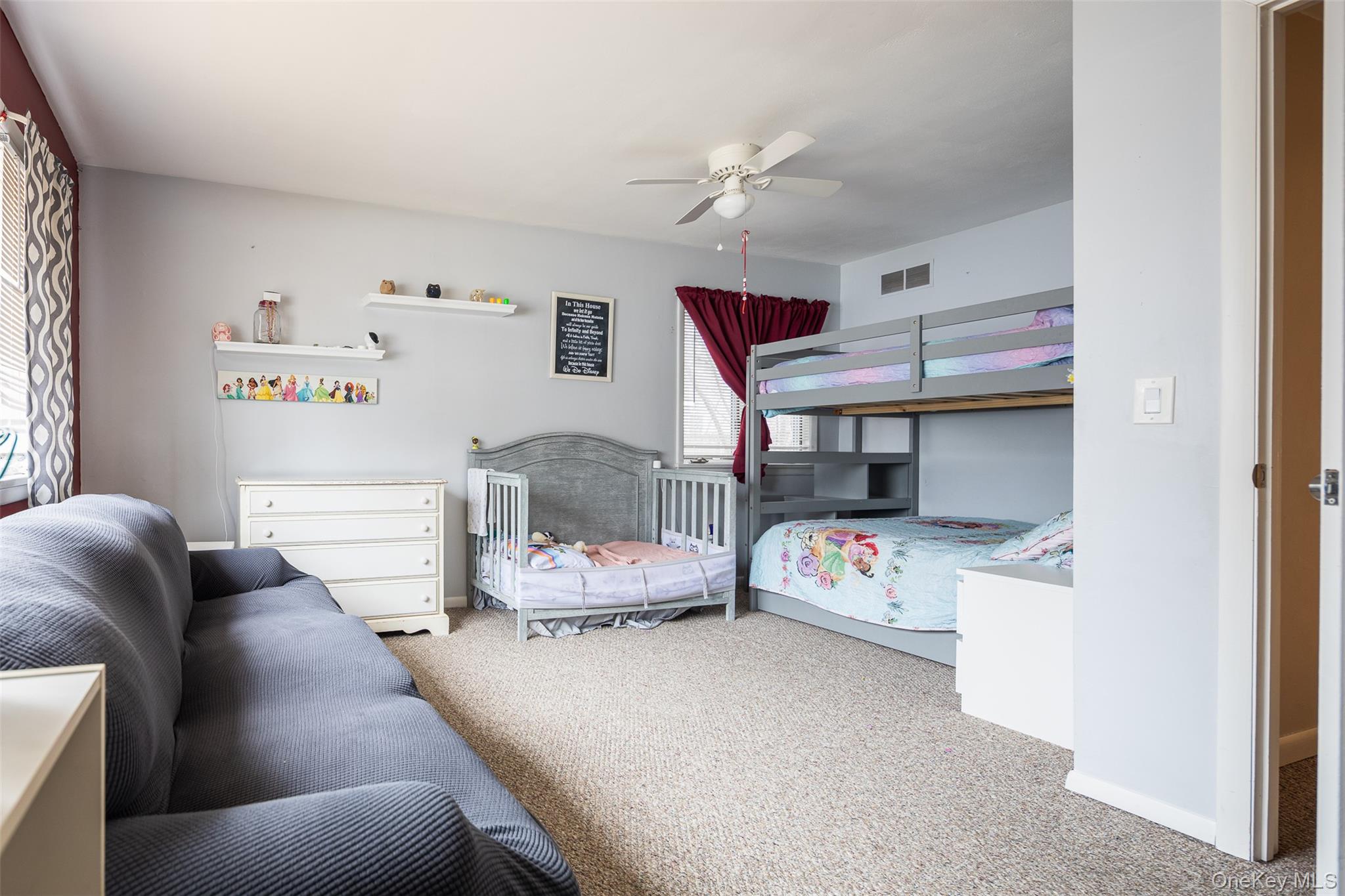 2 Fenwick Street Mastic, NY 11950 - Photo 10 of 27 a bedroom with a bed and a couch