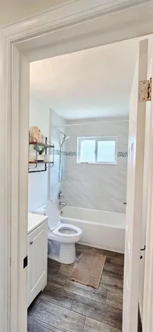 a bathroom with a toilet a sink and a bathtub