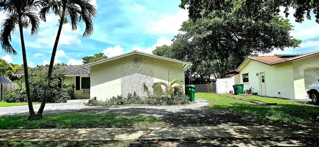 a house with trees in the background