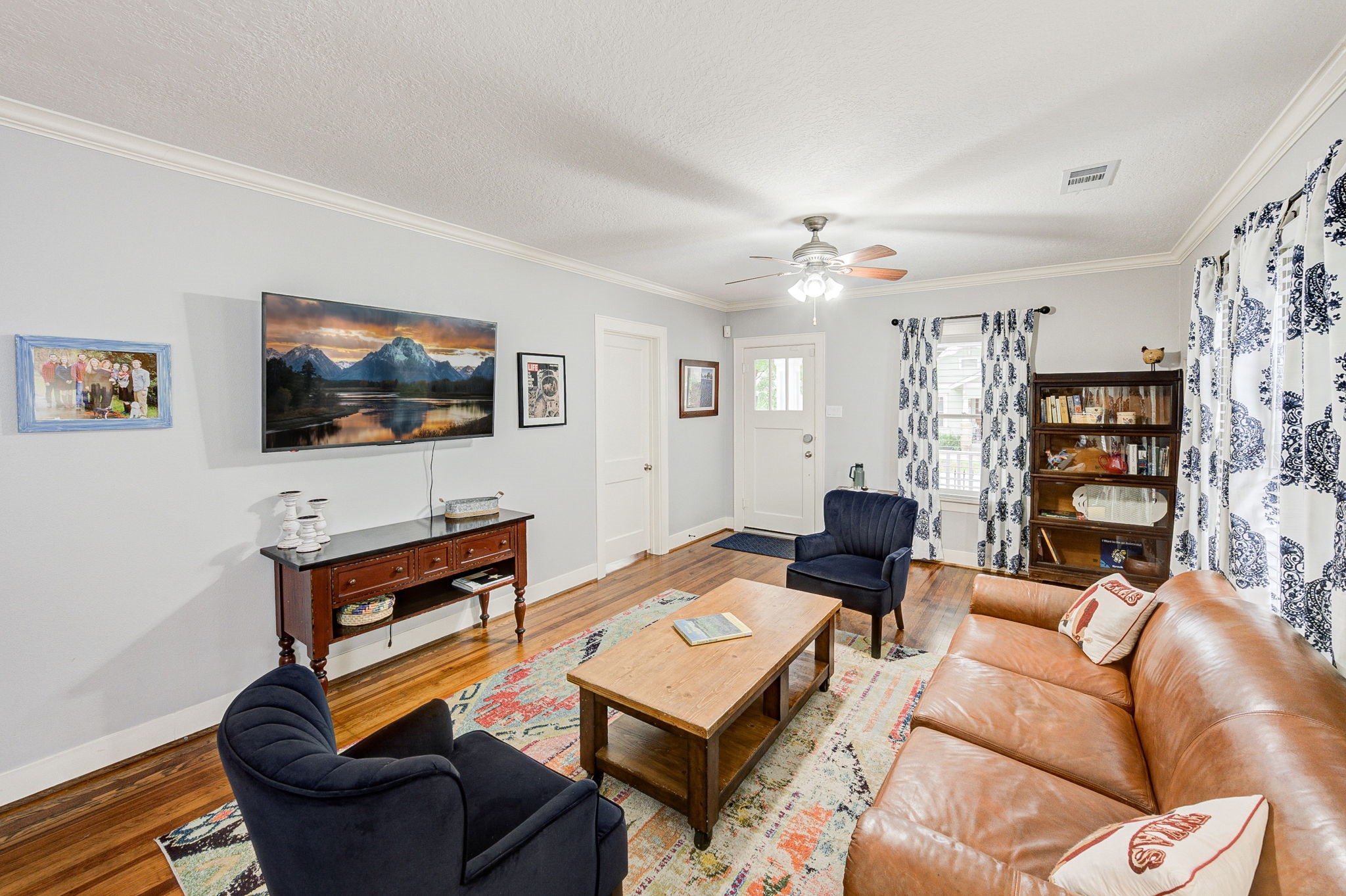 408 Tabor Street Houston, TX 77009 - Photo 11 of 35 a living room with furniture and a flat screen tv