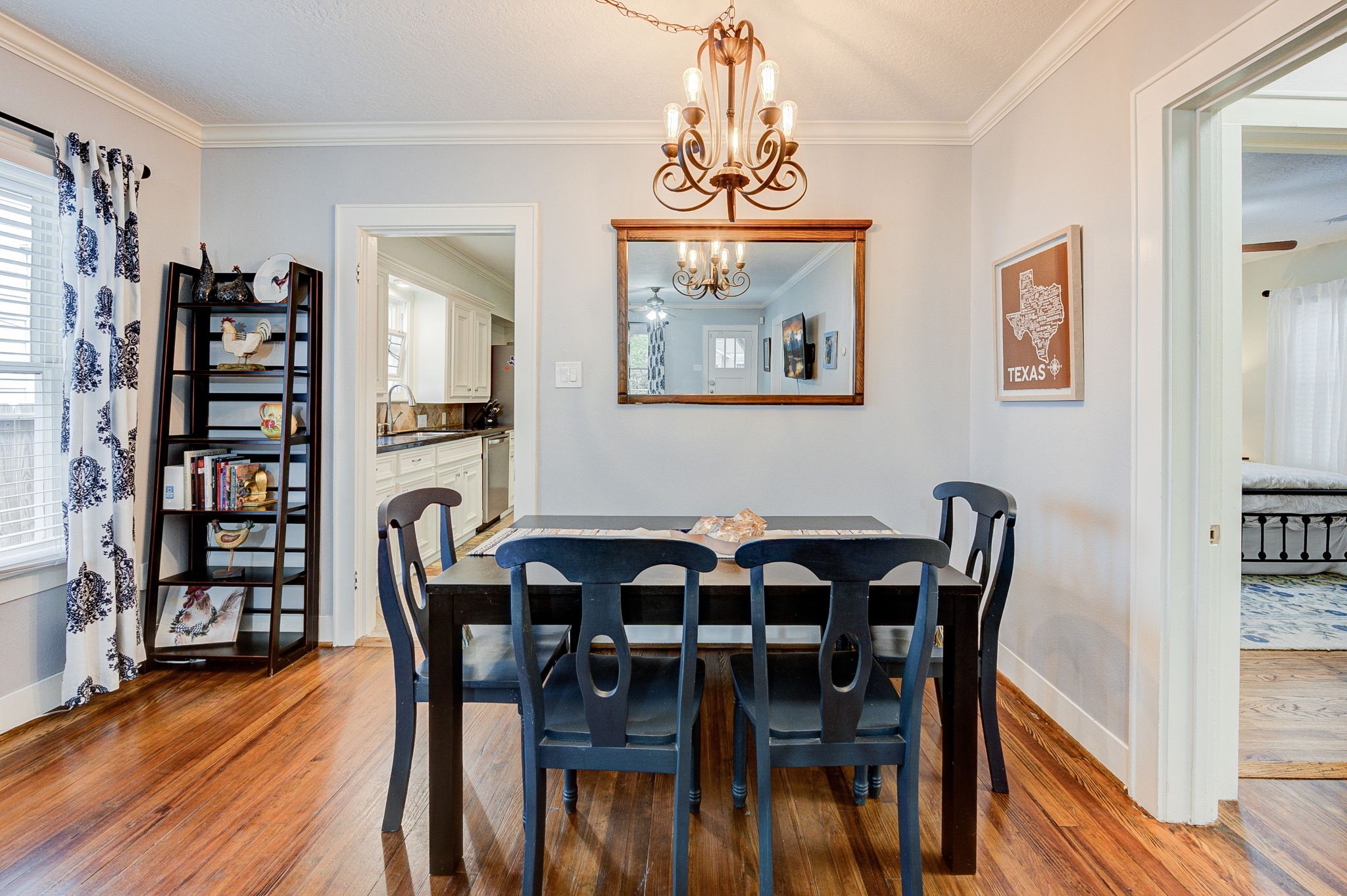 408 Tabor Street Houston, TX 77009 - Photo 12 of 35 a view of a dining room with furniture wooden floor and chandelier