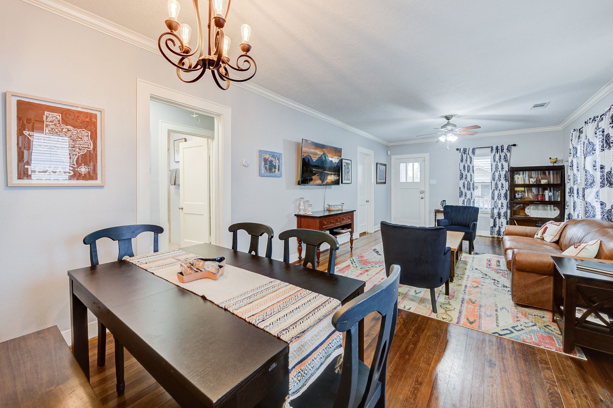 408 Tabor Street Houston, TX 77009 - Photo 14 of 35 a view of a dining room with furniture a rug and wooden floor
