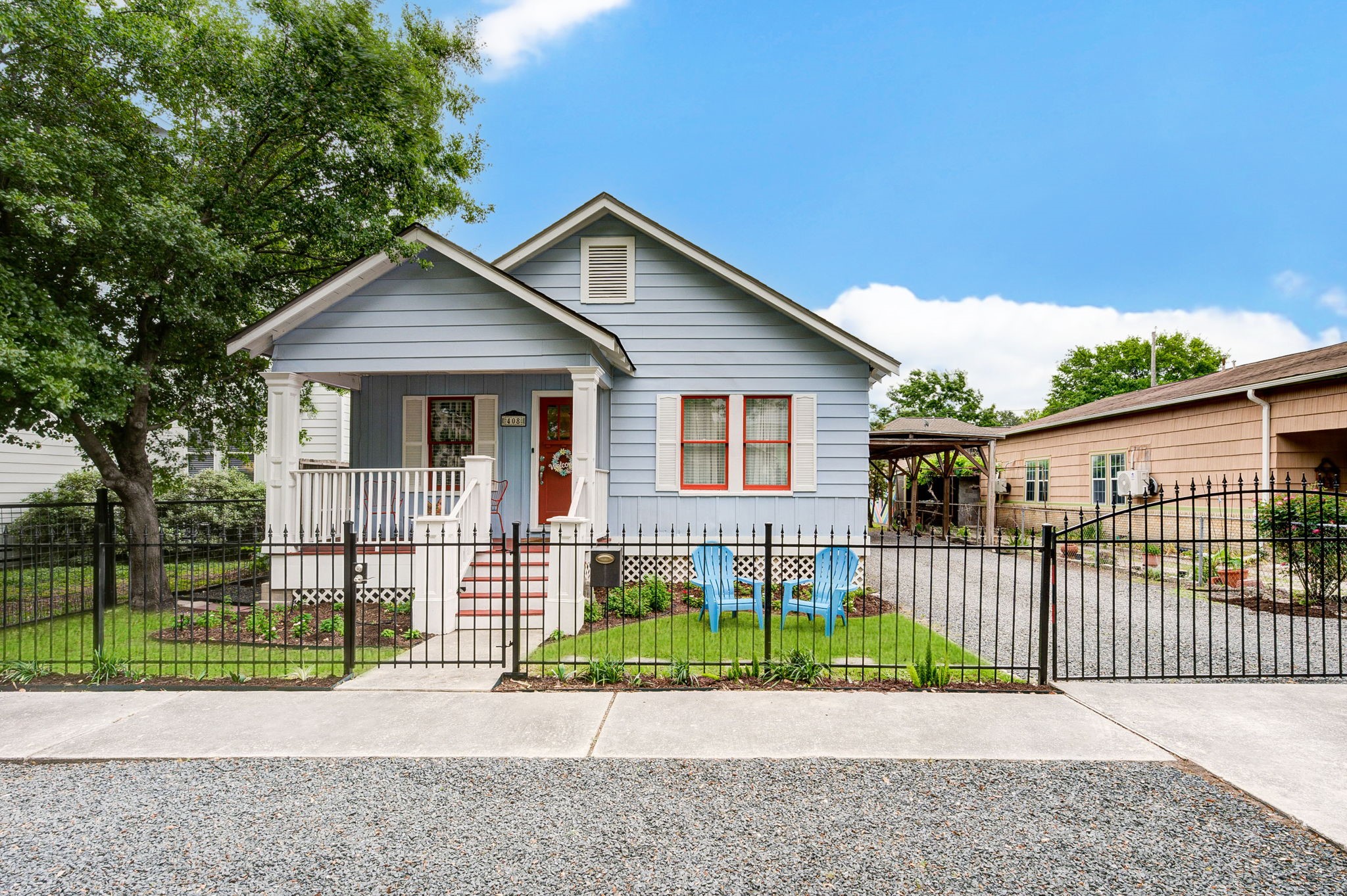 408 Tabor Street Houston, TX 77009 - Photo 2 of 35 a front view of a house with a garden and deck