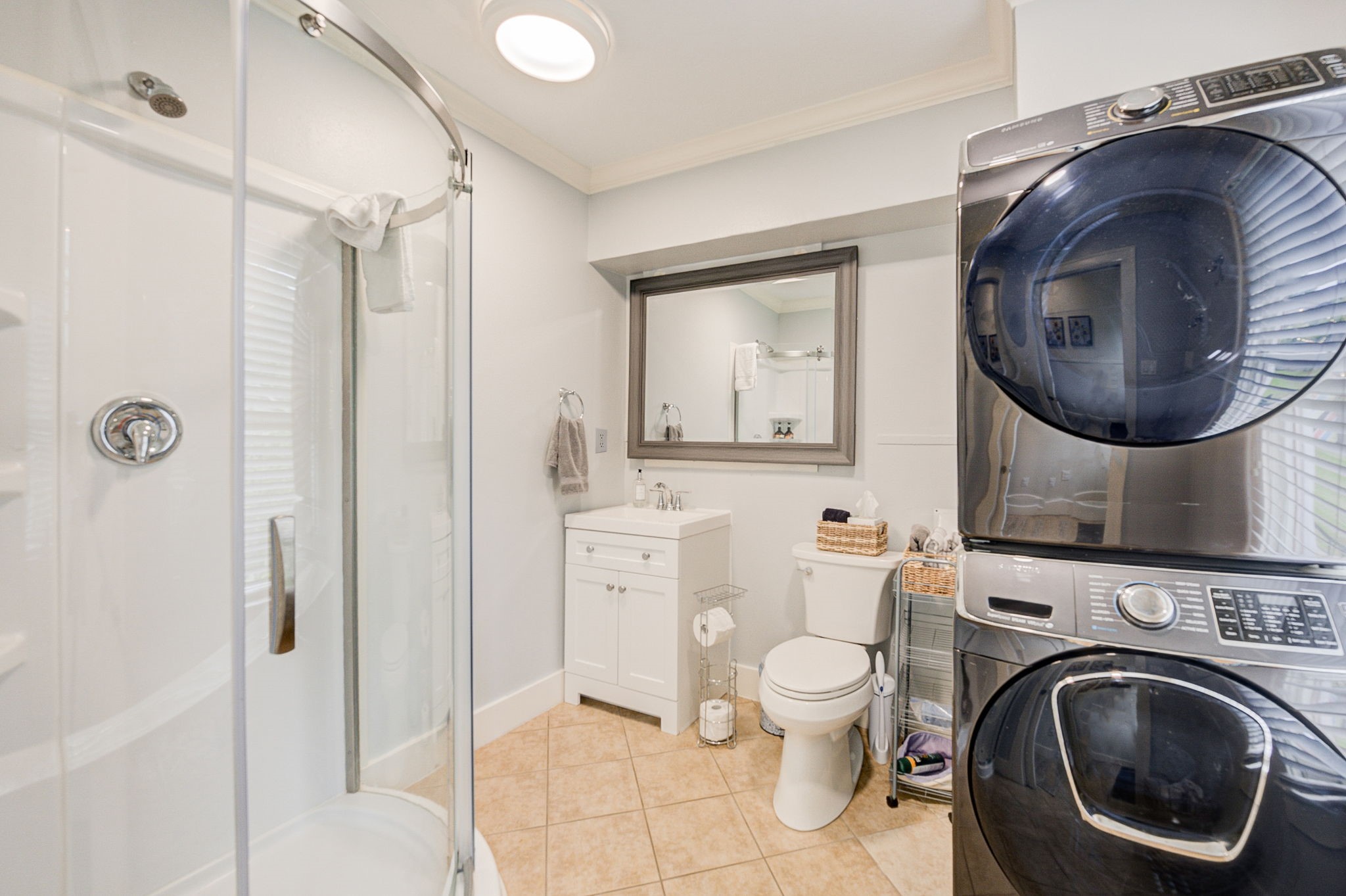 408 Tabor Street Houston, TX 77009 - Photo 22 of 35 a bathroom with a toilet sink vanity and mirror