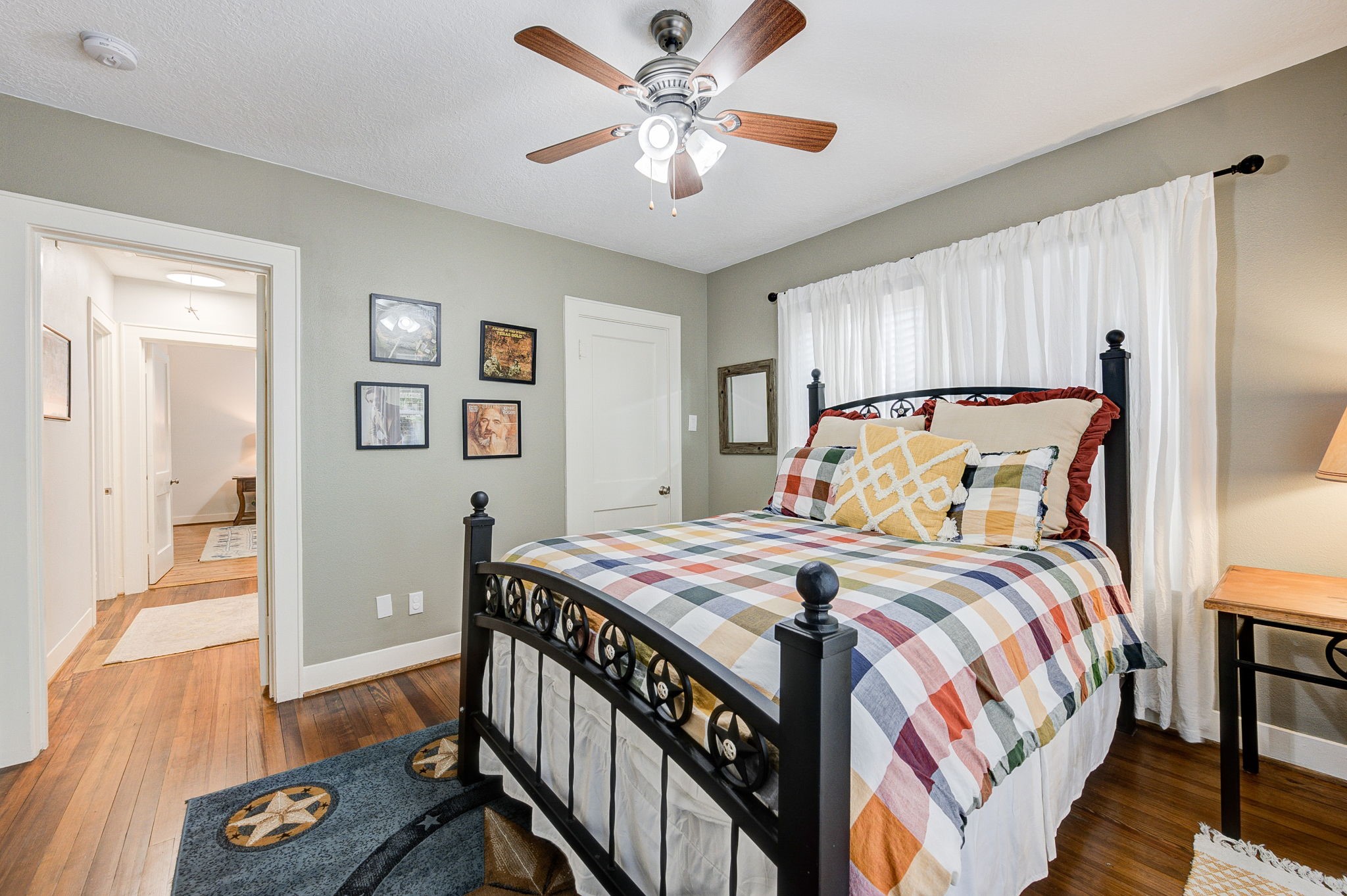 408 Tabor Street Houston, TX 77009 - Photo 27 of 35 a bedroom with a bed and wooden floor
