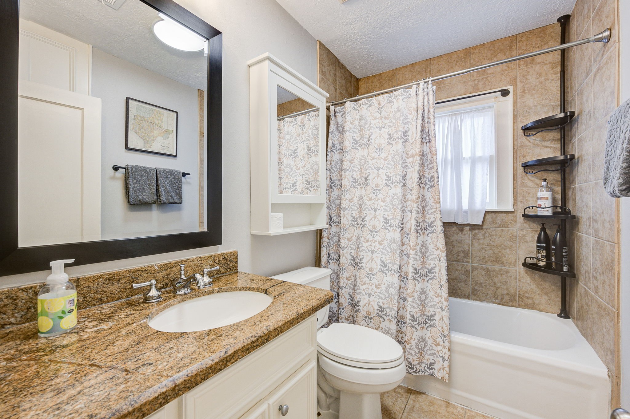 408 Tabor Street Houston, TX 77009 - Photo 28 of 35 a bathroom with a granite countertop sink toilet and shower