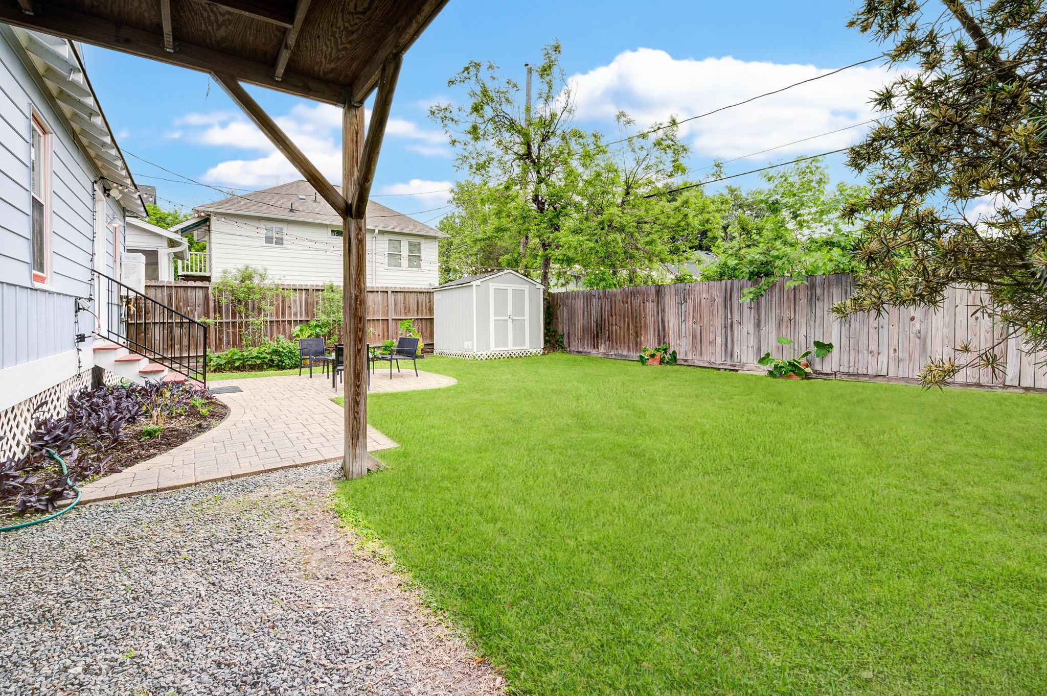 408 Tabor Street Houston, TX 77009 - Photo 34 of 35 a view of a yard with a house and garden