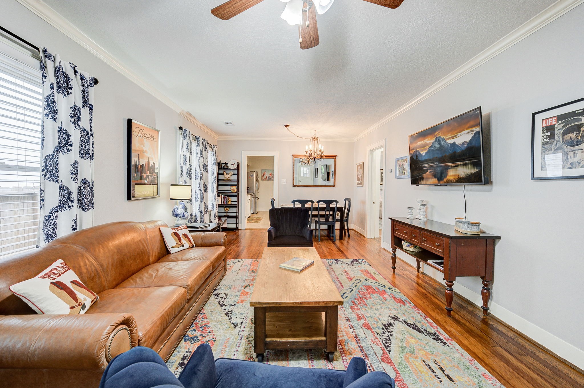 408 Tabor Street Houston, TX 77009 - Photo 10 of 35 a living room with furniture a flat screen tv and a dining table
