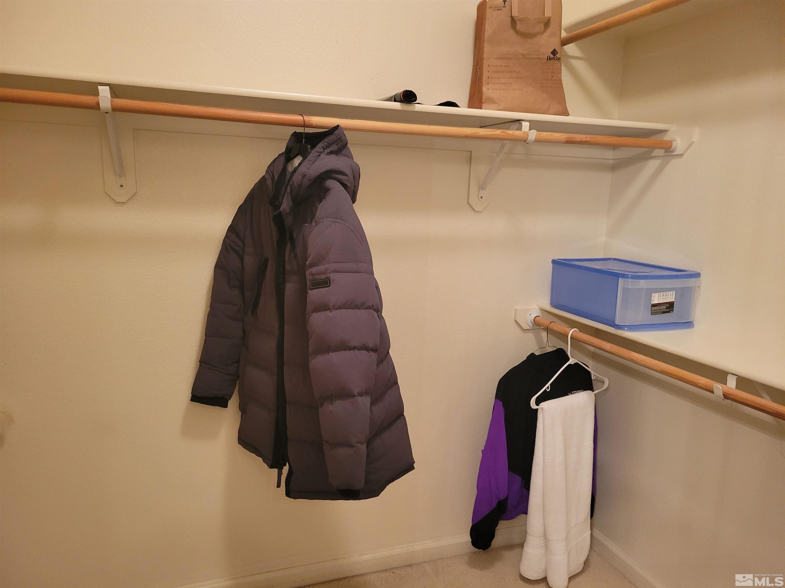 10415 Summershade Lane Reno, NV 89521 - Photo 14 of 15 a view of walk in closet with clothes and shoes