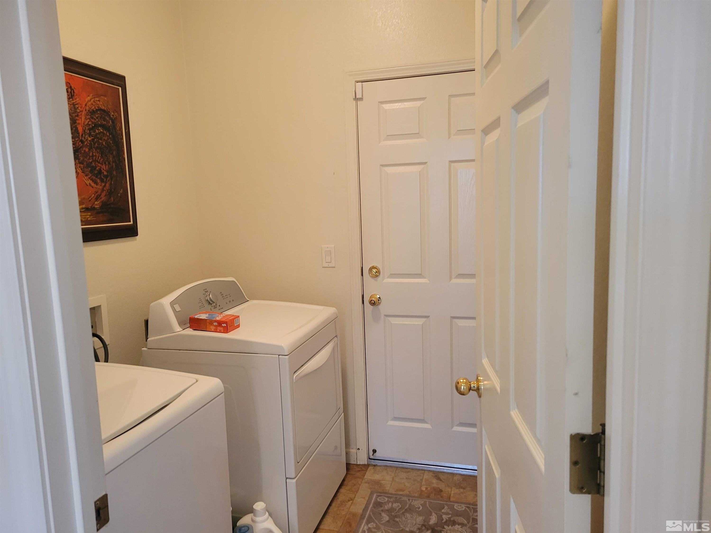 10415 Summershade Lane Reno, NV 89521 - Photo 15 of 15 a view of bathroom with a washer and dryer