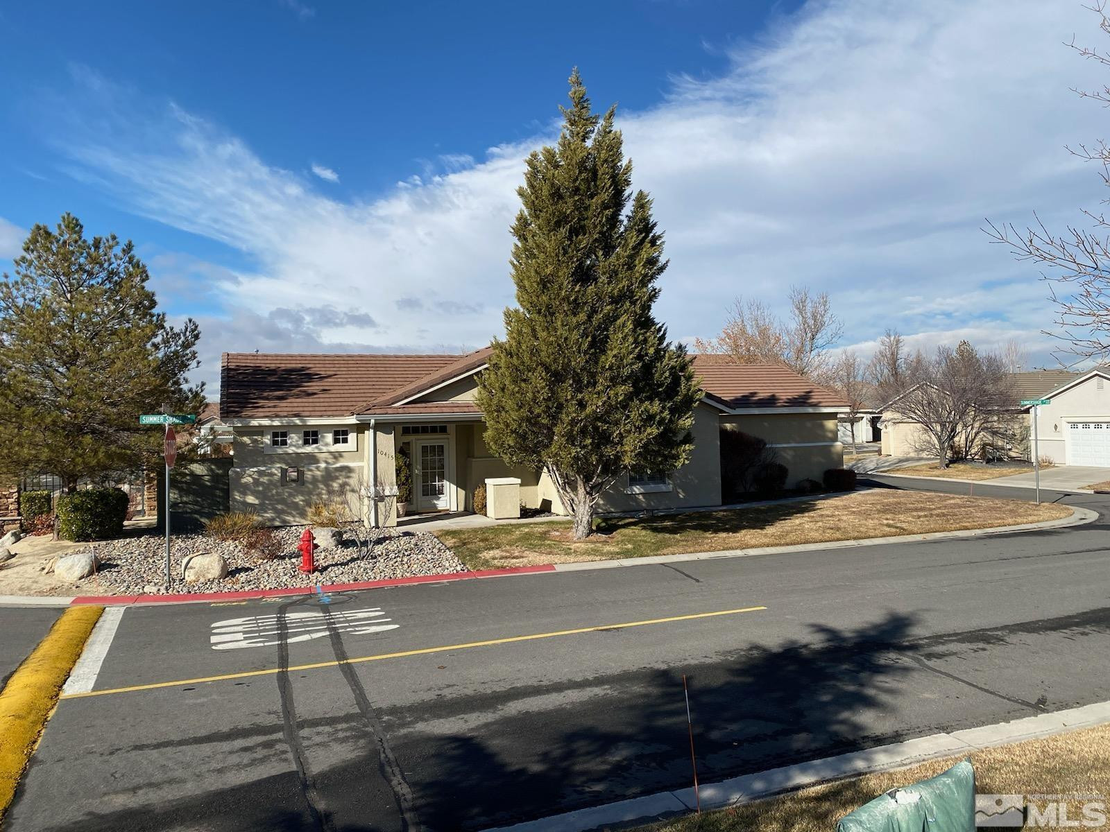 10415 Summershade Lane Reno, NV 89521 - Photo 2 of 15 a outdoor view of a building with traffic signal lights