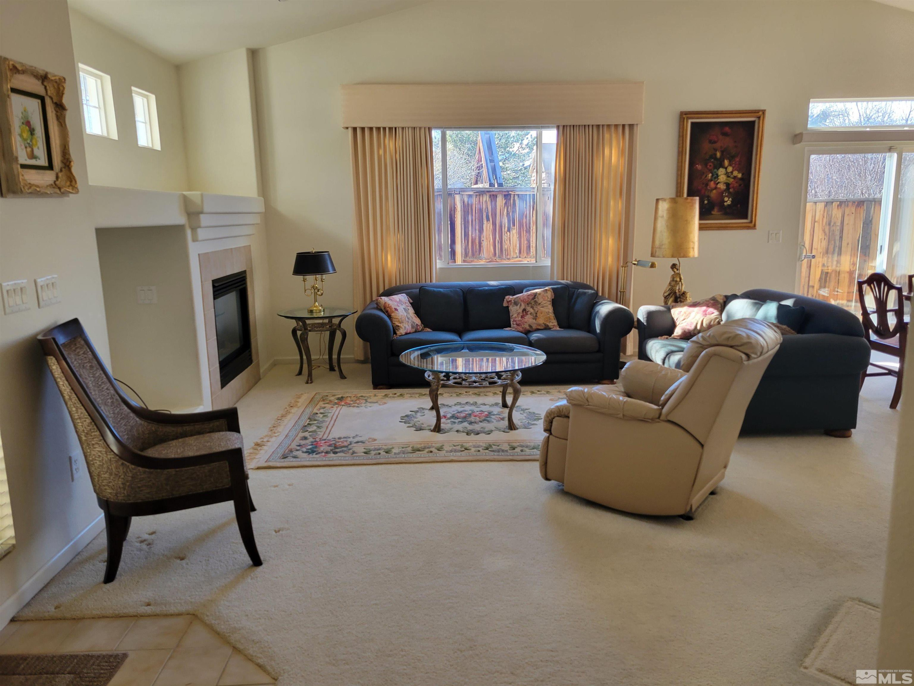 10415 Summershade Lane Reno, NV 89521 - Photo 4 of 15 a living room with furniture and a fireplace