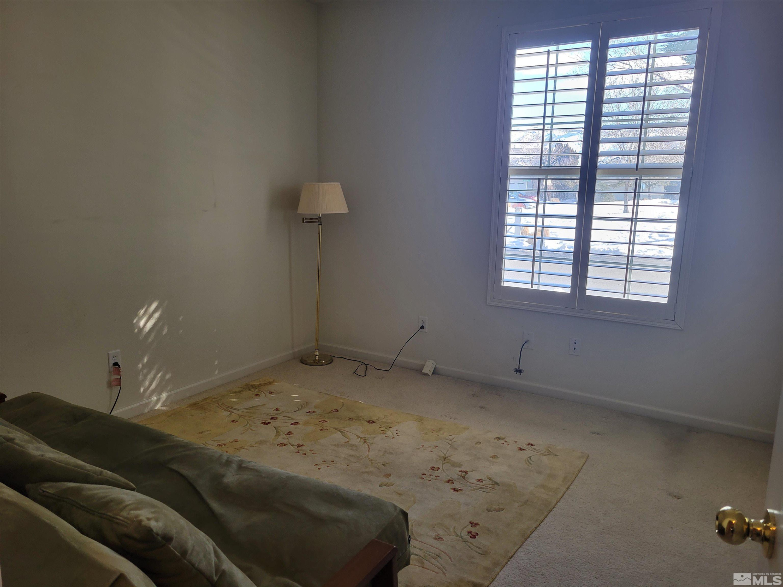 10415 Summershade Lane Reno, NV 89521 - Photo 10 of 15 a living room with furniture and a window