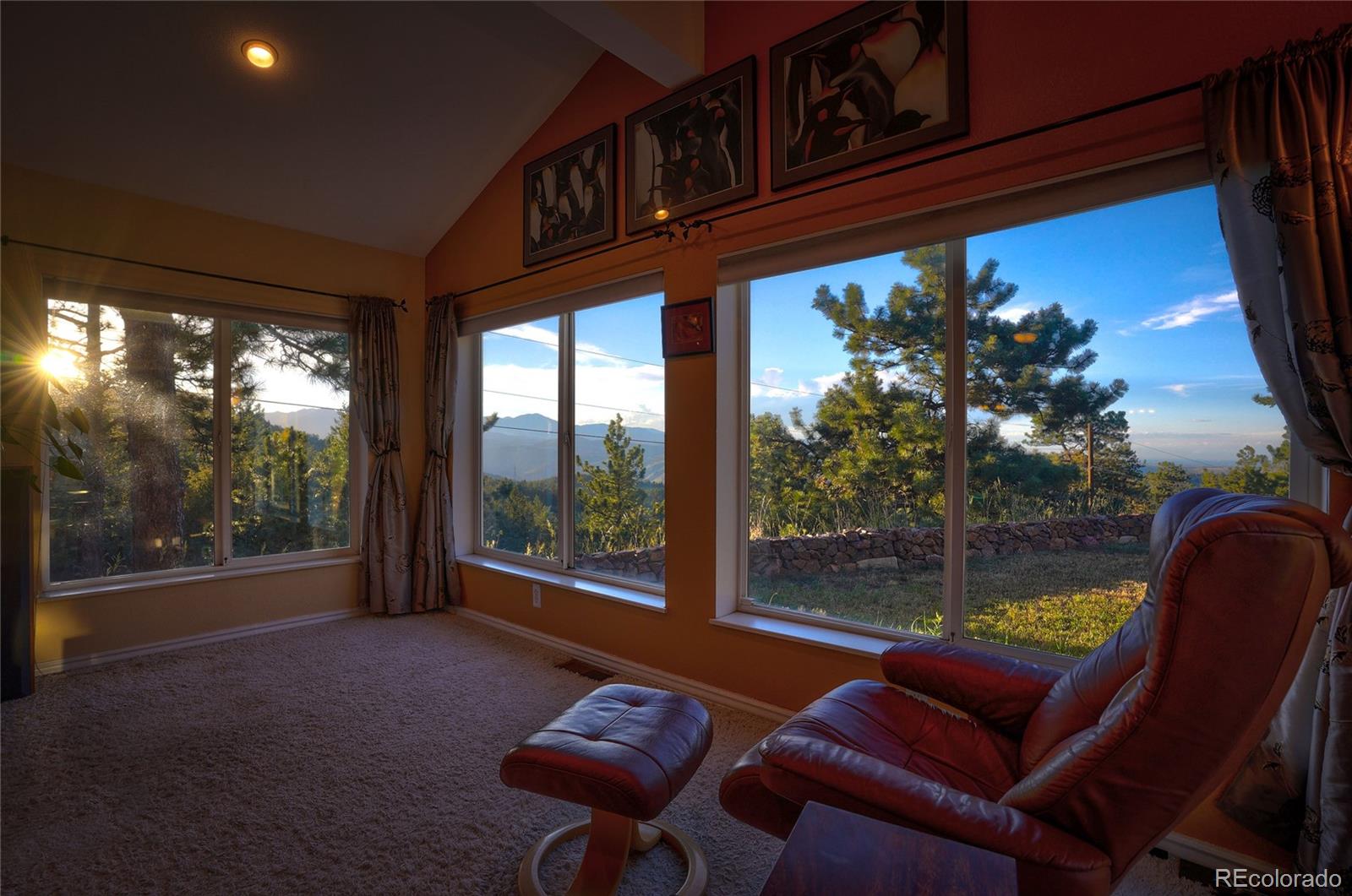 74 South Pine Road Golden, CO 80401 - Photo 8 of 40 a living room with furniture a floor to ceiling window and wooden floor