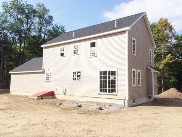 Lot 2 Maple Avenue Rutland, MA 01543 - Photo 3 of 8 a view of a house with snow on the background