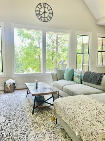 454 Waterville Street Raleigh, NC 27603 - Photo 12 of 25 a living room with furniture and a large window