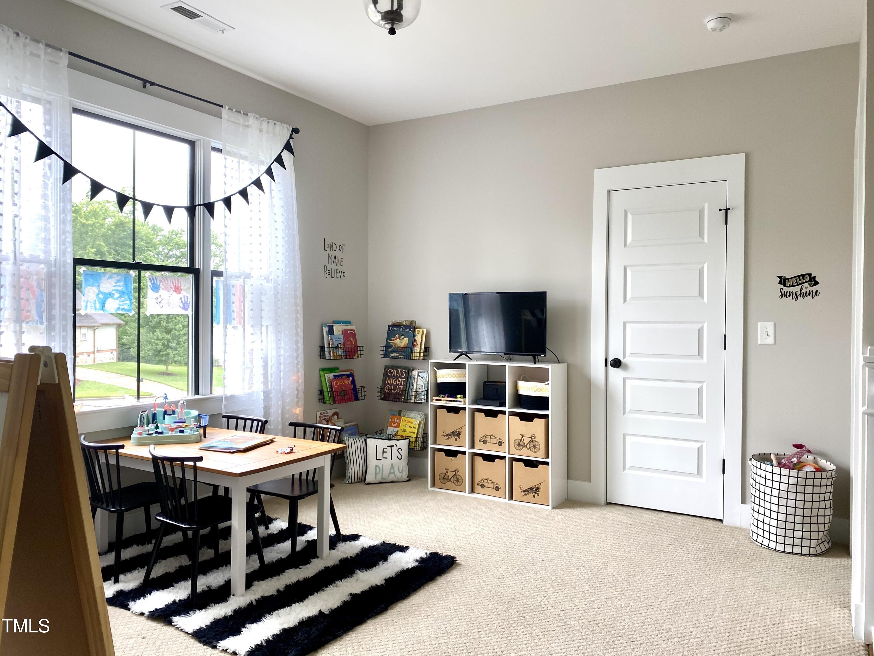 454 Waterville Street Raleigh, NC 27603 - Photo 18 of 25 a view of a livingroom with furniture and window
