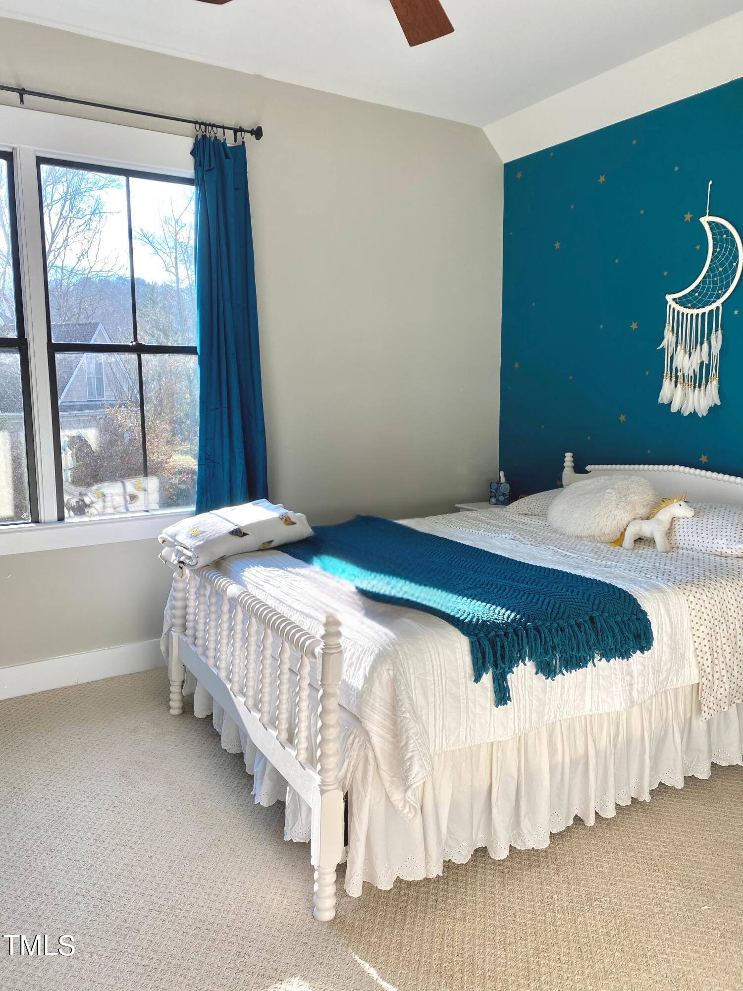 454 Waterville Street Raleigh, NC 27603 - Photo 19 of 25 a bedroom with a bed and a window